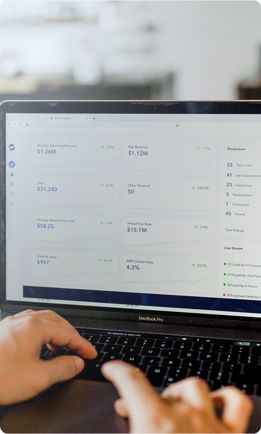 Business person working on laptop with dashboard